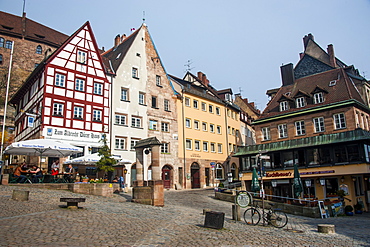 Half timbered houses and open air cafes on Albrecht Duerer square in the medieval town center of the town of Nuremberg, Bavaria, Germany, Europe