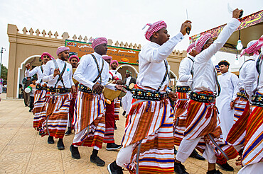 Traditional dressed local tribesmen dancing at the Al Janadriyah Festival, Riyadh, Saudi Arabia, Middle East