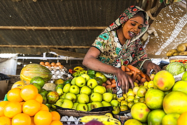 Happy sales woman on her fruit stall, Abeche, Chad, Africa