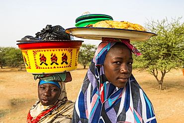 Young girls selling food, Gerewol festival, courtship ritual competition among the Wodaabe Fula people, Niger, West Africa, Africa