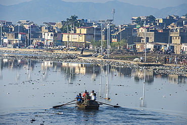 Totally polluted River Mapou flowing through Cap Haitien, Haiti, Caribbean, Central America