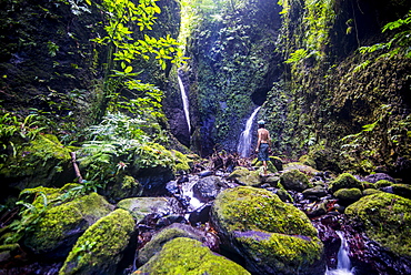 Man looking at the Tafunsak waterfall, Kosrae, Federated States of Micronesia, South Pacific