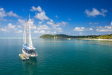 Sailing boat anchoring on Mana Island, Mamanuca Islands, Fiji, South Pacific