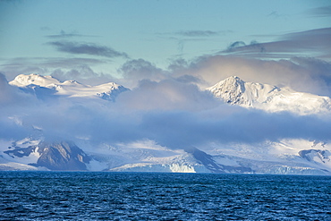 Mountain breaking through the clouds, Elephant Island, South Shetland Islands, Antarctica, Polar Regions