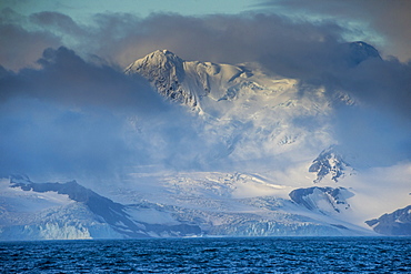 Mountain breaking through the clouds, Elephant Island, South Shetland Islands, Antarctica, Polar Regions