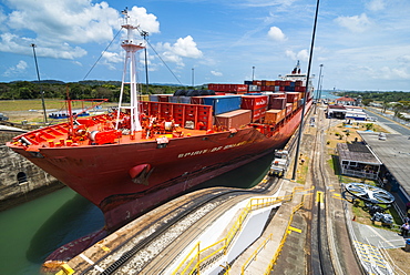 Cargo boats passing the Gatun Locks, Panama Canal. Panama, Central America