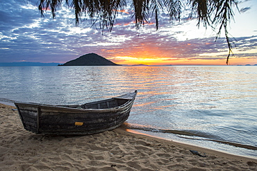 Fishing boat at sunset at Cape Malcear, Lake Malawi, Malawi, Africa