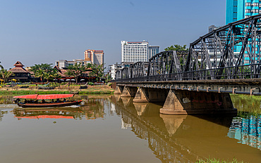 Tourist boat sailing by the Victorian era Iron Bridge, Chiang Mai, Thailand, Southeast Asia, Asia