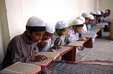 Religion, pakistan. Punjab. Children reading the koran at a madrassa mulim school