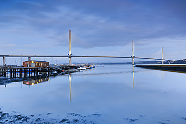 The Queensferry Crossing at dusk, view from the Fírth of Forth at South Queensferry near Edinburgh, Scotland, United Kingdom, Europe