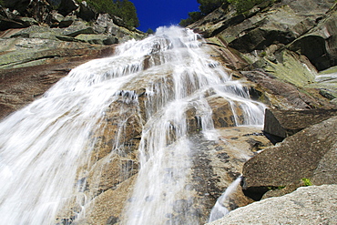 Swiss alps, mountain waterfall in springtime, bernese , bern, switzerland