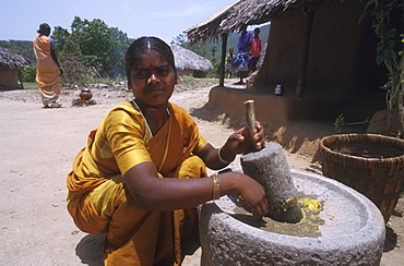 India - women - labour: woman grinding chillis, tamil nadu