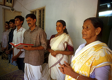 India - religion - christian syro-malabar catholic family at prayer akkaparambu, kerala