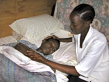 Kenya catholic lay missionary visiting woman. Korogocha, nairobi