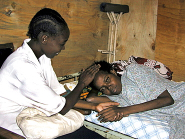 Kenya catholic lay missionary visiting woman. Korogocha, nairobi