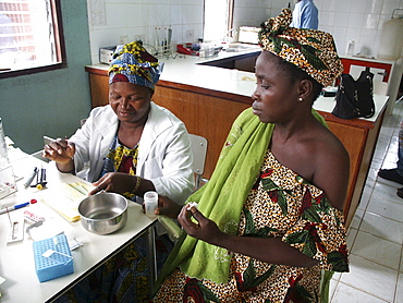 Gambia taking blood for hiv at wec clinic birkana