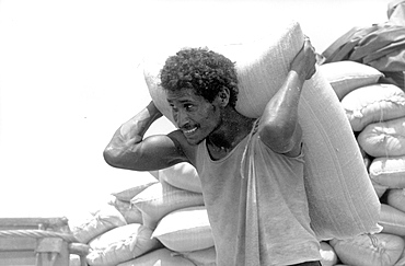 Worker unloading aid at docks. Massawa, eritrea