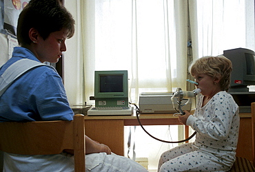 Health, clinics child using inhaler at prague general hospital, czech republic