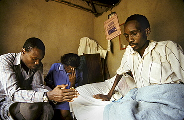 Uganda mobile health nsambye hospital, kampala, praying man who has