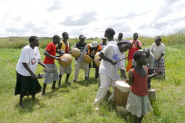 UGANDA The work of Comboni Samaritans, Gulu. The Gwoke Ber AIDS support group. They keep up their spirits by music and dance, and also perform drama skits to teach about avioding AIDS in the local villages. PHOTO by Sean Sprague