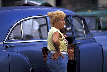 Woman and old u.s. car as, havana