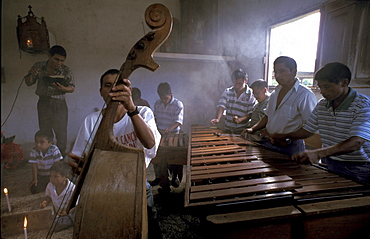 Guatemala marimba in a catholic church at cahaba, peten