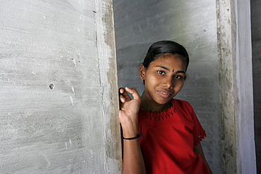 India visits to post, tsunami site in srayickadu kollom, kerala, where cnewa funds relief efforts through the social services office of the syro, malankar church. Family of shaji gobal (47), fisherman, his wife jayasree (38) and their surviving daughter shinthu (15). They lost their other daughter, chikku (17) in the disaster. Note that the new house which they are in was built and donated by the matha amrithanandamayi mssion ashram, as were 1300 other houses in the area. Cnewa had managed to build one house during the 13 months since the disaster.  Sp1140194