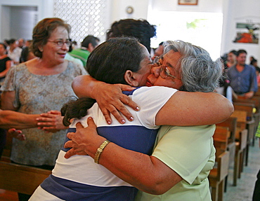 Honduras of peace during catholic mass. slum barrio of chamelecon, pedro sula