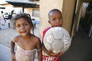 Namibiachildren, many of whom aids orphans positive themselves at bernard nordkamp (youth) center,katatura, a black township of windhoek, (dating from apartheid). With football.