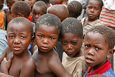 Namibia a feeding centre hungry children in rundu. Most of these children aids orphans, or positive themselves, or both. A catholic church organization provides them with a daily meal, perhaps only decent food they. hunger is evident in their eyes expressions