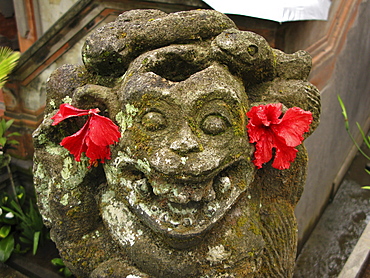 Indonesia moss covered statue, ubud, bali 