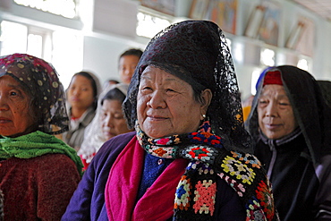 Myanmar sunday mass in catholic church at myitkyina, a largely kachin, catholic, community in north burma near chinese border. Women singing hymns 