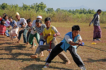 Myanmar school children enjoying a of game, myitkyina, a largely kachin community in north burma near chinese border 