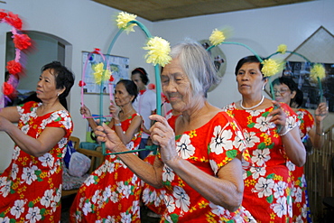 Philippines women dancing at a class in a slum district, bagnong silangan, quezon city, manila