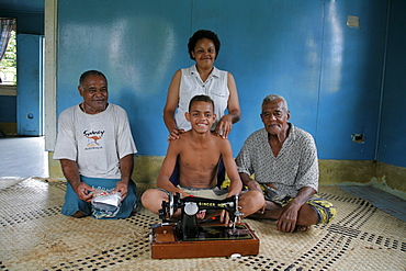 Fiji teresia waimila, 17, with brother, father and uncle, taveuni photo by sean sprague