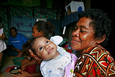 Fiji grandmother and baby, qeleni village, taveuni photo by sean sprague