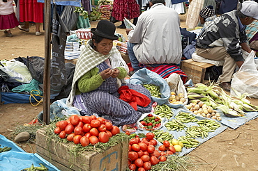 Bolivia. Aymara women selling potatoes and other vegetables at a street market in el alto