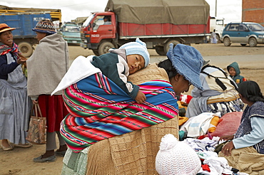 Bolivia. Aymara mother and child at a street market in el alto