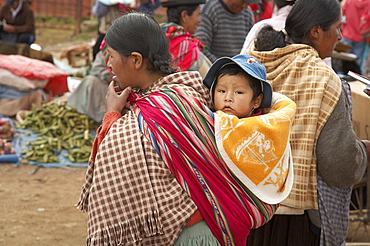 Bolivia. Aymara mother and child at a street market in el alto