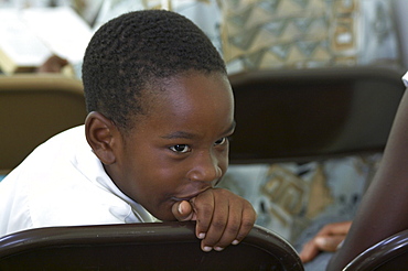 Jamaica. Boy at sunday mass at catholic church in chester castle