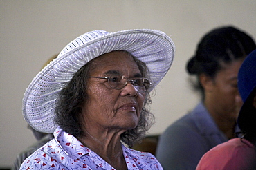 Jamaica. Woman at sunday mass in the catholic church at seaford town