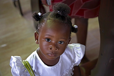 Jamaica. Girl at sunday mass in the catholic church at seaford town