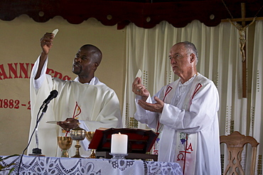 Jamaica. Priests con celebrating at sunday mass in the catholic church at seaford town