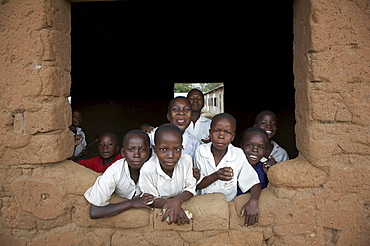 Tanzania school children looking out of window of classroom, kalabezo