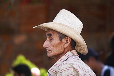 El salvador el mozote, site of the massacre of children in 1981. face of person attending annual memorial celebration