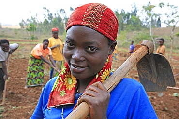 Burundi woman carrying a hoe, gitera.