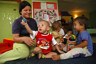 Colombia mother relating to her children at a day care and child stimulation center run by dni (international defence of children) in barrancabermeja