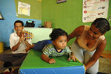 Colombia mother relating to her children at a day care and child stimulation center run by dni (international defence of children) in barrancabermeja