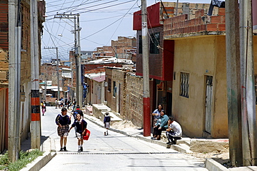 Colombia girls walking home from school in ciudad bolivar, bogota