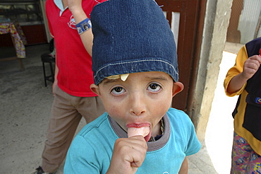 Colombia boy eating ice cream, altos de cazuca, bogota